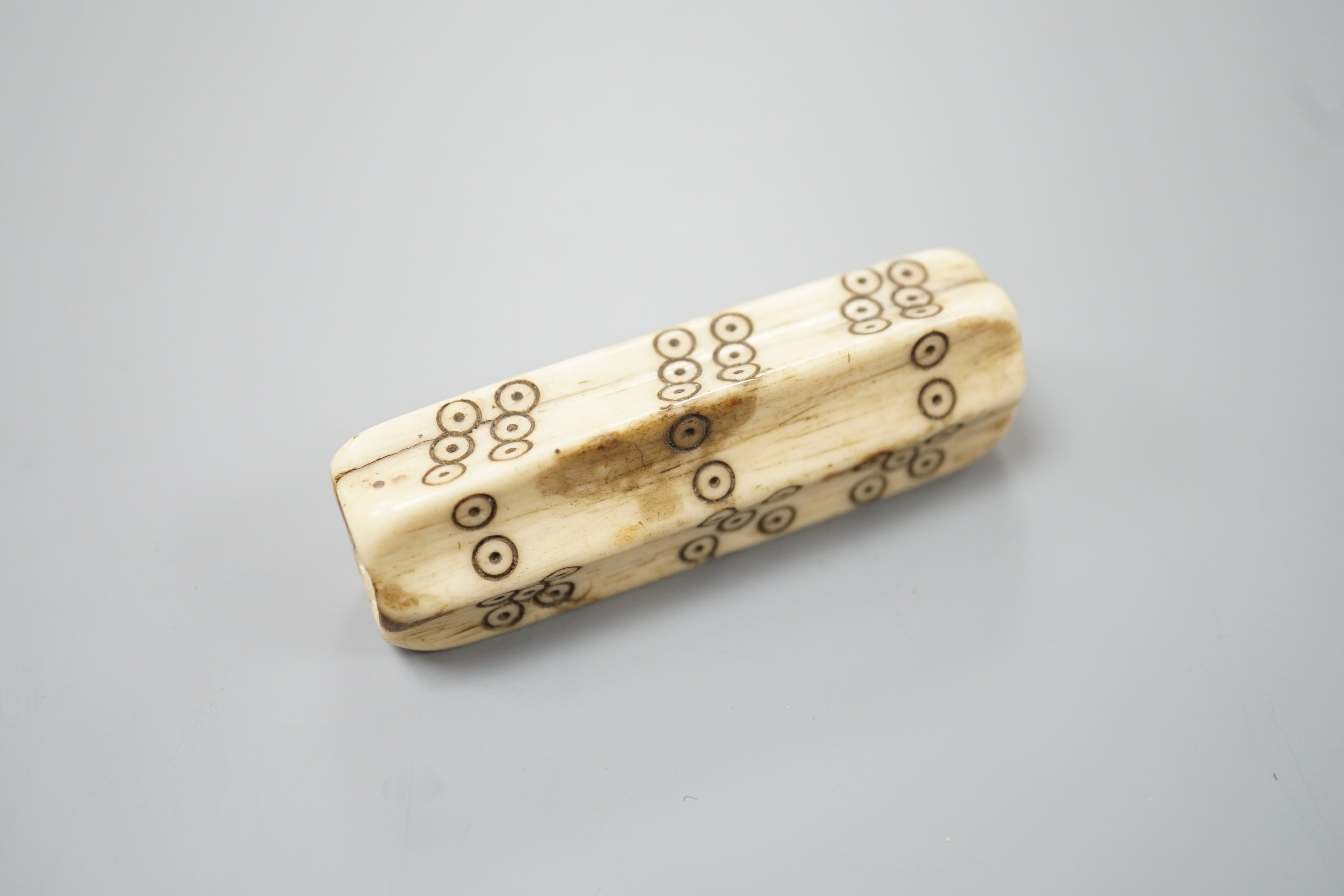 An early European bone six sided long dice, 6.8cm, cf. a similar example in the British Museum No. 1871,0910.2